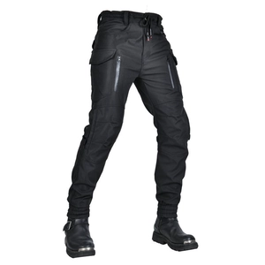 Detail of waterproof motorcycle pants featuring zipper pockets and elastic drawstring waist
