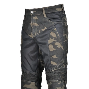 Macro shot of breathable mesh and accordion stretch panels on camo motorcycle pants
