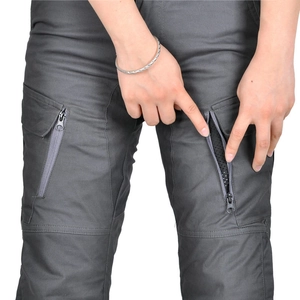 Detail of cargo motorcycle pants showing side zipper pocket and breathable mesh lining