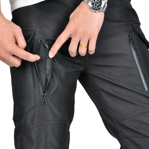 Detail of tactical pants showing zipper side pocket and breathable mesh lining