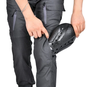 Detail of Level 2 CE certified knee protection pads being inserted into cargo riding pants