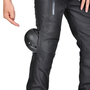 Detail of waterproof motorcycle cargo pants featuring reinforced honeycomb knee armor padding