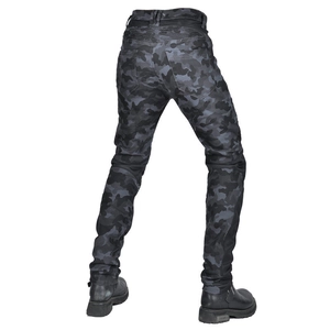 Detail of motorcycle pants with camouflage pattern and accordion stretch panel on the waist
