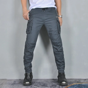 Detail of dark blue motorcycle jogger cargo pants featuring elastic waist and large side pockets