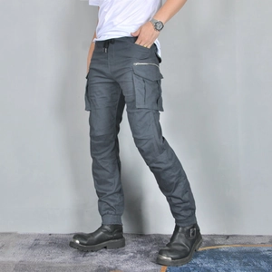 Detail view of motorcycle cargo pants featuring multiple utility pockets and side zippers