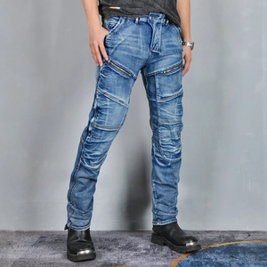 Detail of blue motorcycle jeans with ribbed knee panels and metal zipper accents