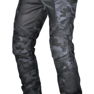 Close-up of camouflage motorcycle pants featuring breathable mesh and flexible knee joints