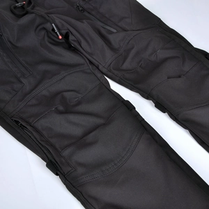 Detail of waterproof motorcycle cargo pants with drawstring waist and reinforced knees