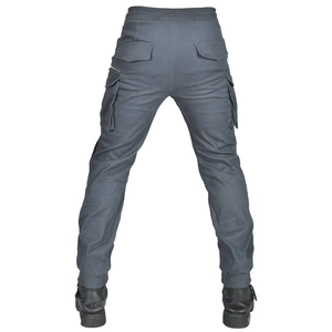 Detail view of motorcycle cargo pants with multiple pockets and elastic cuffs