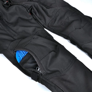 Close-up of waterproof motorcycle pants with removable blue honeycomb silicone knee pads