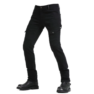 Detail of slim-fit military green motorcycle jeans with side cargo pockets and biker boots
