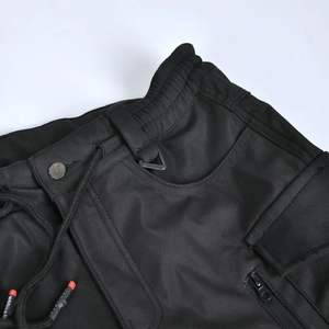 Detail of high elastic waist with adjustable drawstring and metal D-ring on riding pants