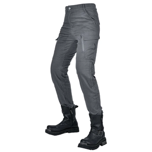 Close-up of high-waisted motorcycle pants featuring reinforced knee armor and tactical pockets