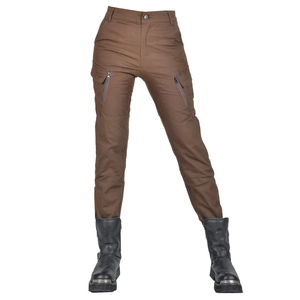 Detail of brown tactical motorcycle pants with large zip pockets and heavy duty boots