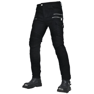 Close-up of black motorcycle jeans with silver zippers and reinforced accordion knees