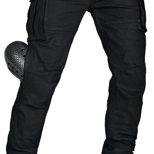 Detail of black motorcycle cargo pants featuring honeycomb protective knee pads and pockets