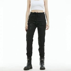Detail of waterproof motorcycle cargo pants with zip pockets and drawstring waist