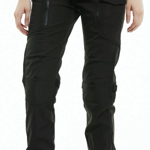 Detail of waterproof zipper pockets and protective knee pads on black motorcycle pants