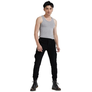Black cargo biker pants with large flap pockets and ribbed cuffs for outdoor riding