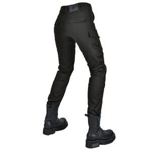 Close-up of black tactical motorcycle pants featuring reinforced waist and leather logo