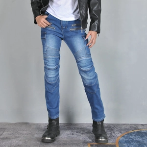Detail of biker jeans featuring accordion stretch panels and metal zipper pockets on thighs