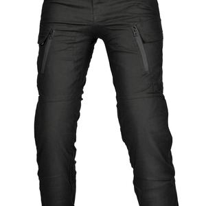 Detail of black tactical motorcycle pants featuring zipper pockets and knee stitching
