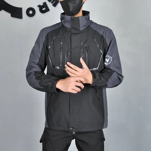 Detail of waterproof zippers and adjustable velcro cuffs on a winter motorcycle jacket