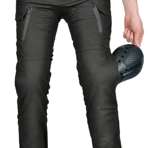 Detail of CE certified knee protectors on tactical motorcycle pants with zipper pockets