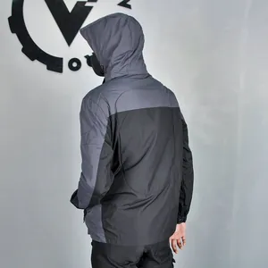 Rear view of waterproof motorcycle jacket with gray and black ergonomic patchwork design
