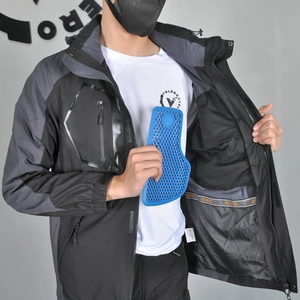 Detail of waterproof motorcycle jacket showing interior honeycomb protective pads and mesh lining