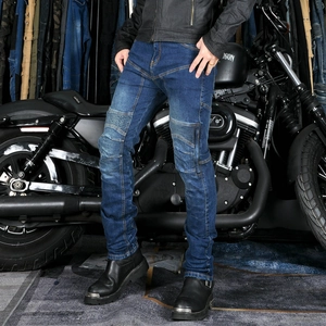 Close-up of flexible accordion panels on knee and waist of blue motorcycle jeans