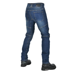 Detail view of motorcycle jeans with accordion panels and reinforced stitching on dark denim