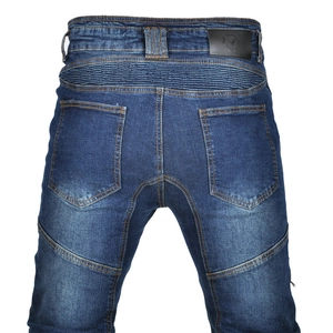Detail of accordion stretch panels and leather patch on blue motorcycle jeans