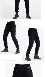 Detail of black motorcycle cargo pants featuring elastic waist and reinforced side pockets