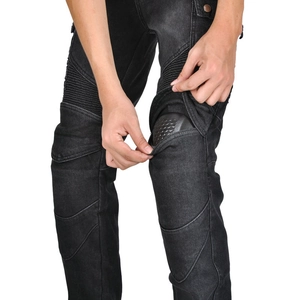 Detail of black motorcycle jeans featuring accordion stretch panels and CE knee protectors