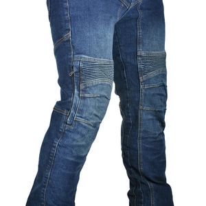 Detail of blue motorcycle denim jeans featuring accordion stretch panels and a zipper pocket