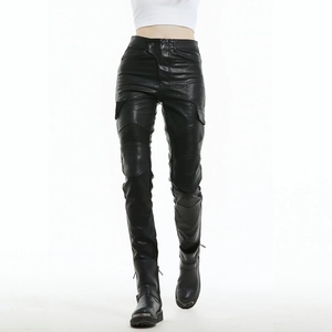 Detail of waterproof matte leather motorcycle pants with flexible pleated knee panels