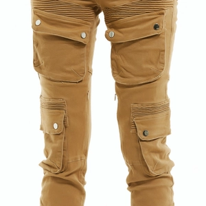 Detail of khaki motorcycle pants featuring ribbed knee panels and cargo flap pockets