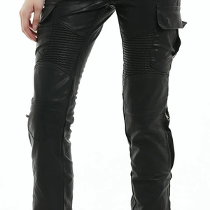 Detailed view of motorcycle pants with protective knee pleats and leather texture