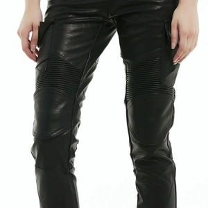 Detail of black motorcycle leather pants featuring cargo pockets and knee stretch panels