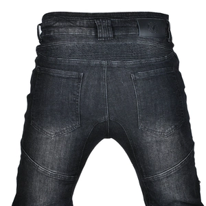 Detailed back view of motorcycle jeans featuring stretch panels and leather logo patch