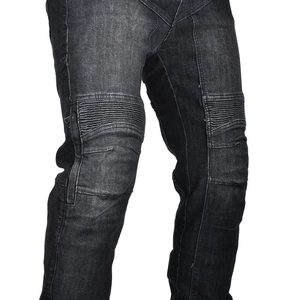 Detailed close-up of accordion stretch panels on black denim motorcycle riding pants
