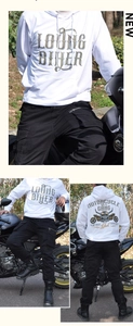 Detail of white biker hoodie with skull graphic and black cargo pants for motorcycle riding