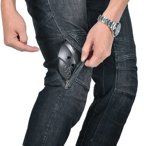 Detail view of motorcycle jeans with knee armor and flexible pleated stretch panels
