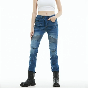 Detail of slim-fit blue motorcycle jeans with protective knee stretch panels for women