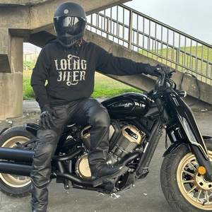 Men's black motorcycle riding gear featuring hooded sweatshirt and Napoleon cruise bike