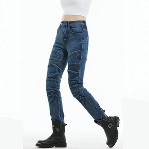 Detail of blue motorcycle jeans with diamond-stitched reinforcement and accordion panels