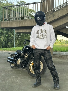 Full body view of white biker hoodie with retro print and protective riding cargo pants