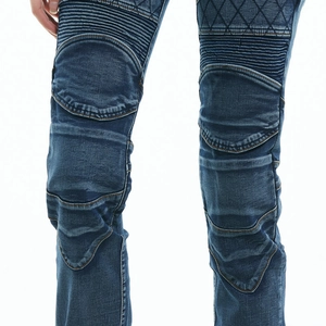Close-up of moto-style ribbing and diamond quilted stitching on blue motorcycle jeans