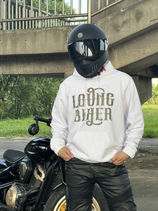 Detail of white hooded biker sweatshirt featuring LOVING BIKER graphic on a male model